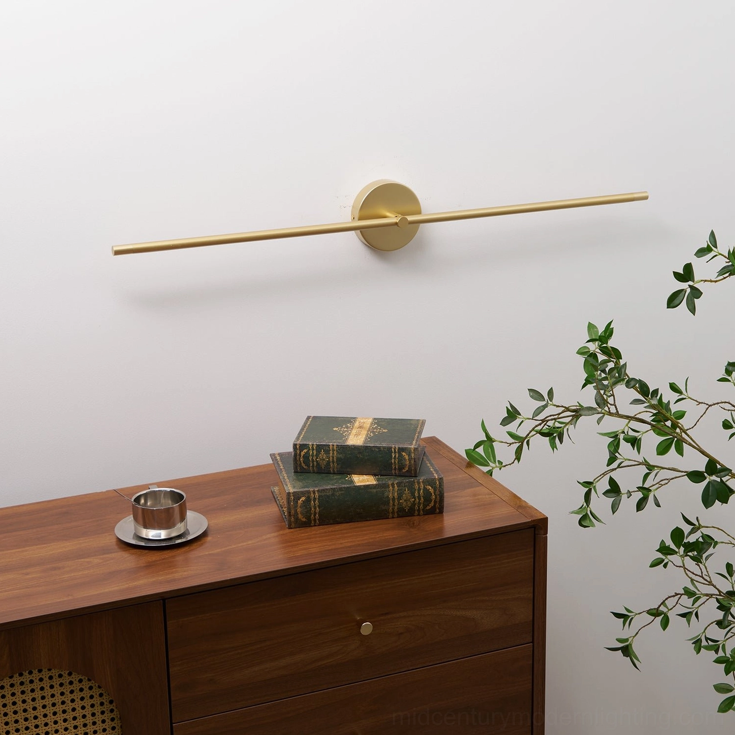 Warm gold linear wall lamp casting ambient light in contemporary bedroom setting