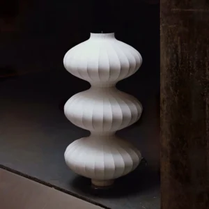 Stacked gourd silk floor lamp three-quarter view in industrial modern space, showing sculptural form