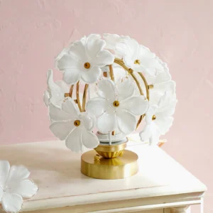 Grace Floral Botanical Lamp on pink textured wall nightstand with white surface and decorative flower accent