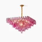 Gramercy Diamond Chandelier in fuchsia pink crystal with tiered inverted pyramid design, frontal view on white background