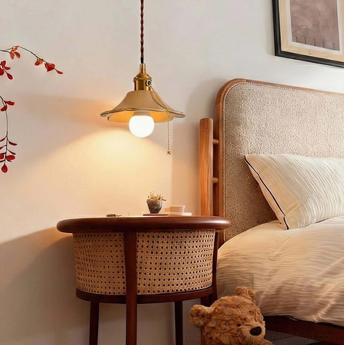 Vintage ceramic pendant light with brass-ceramic design hanging in warm bedroom interior with wicker nightstand