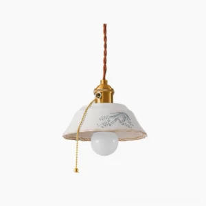 Grange ceramic pendant light with hand-printed floral shade and brass hardware hanging on white background