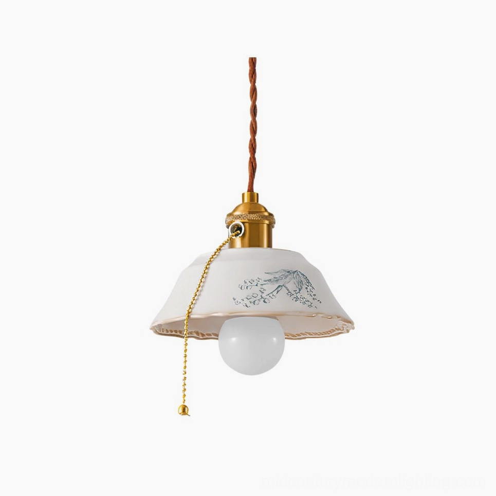 Grange ceramic pendant light with hand-printed floral shade and brass hardware hanging on white background