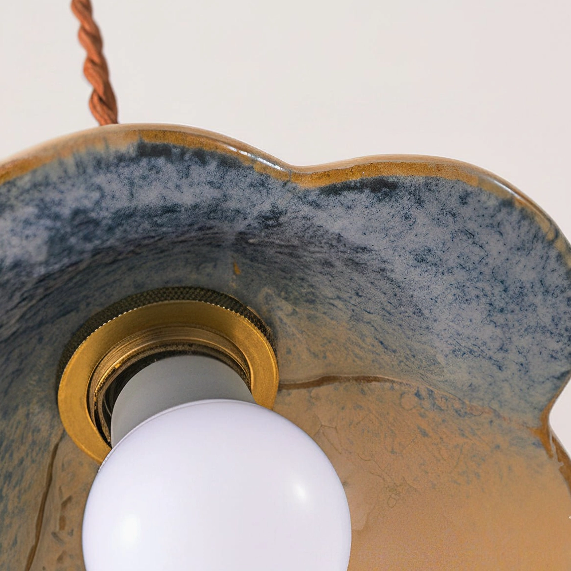 Bottom interior view of ceramic pendant light showing gradient glaze rim and beige inner glaze finish