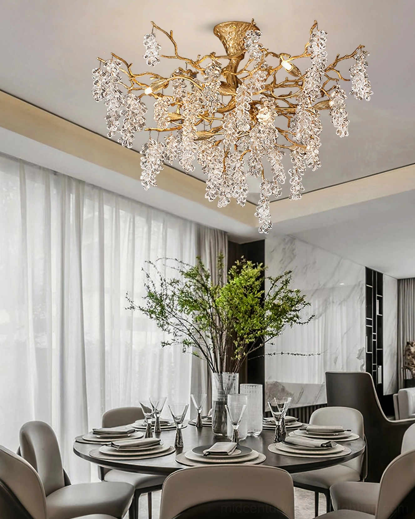 Formal dining room with grape bunch chandelier suspended over round dining table, sophisticated luxury lighting design