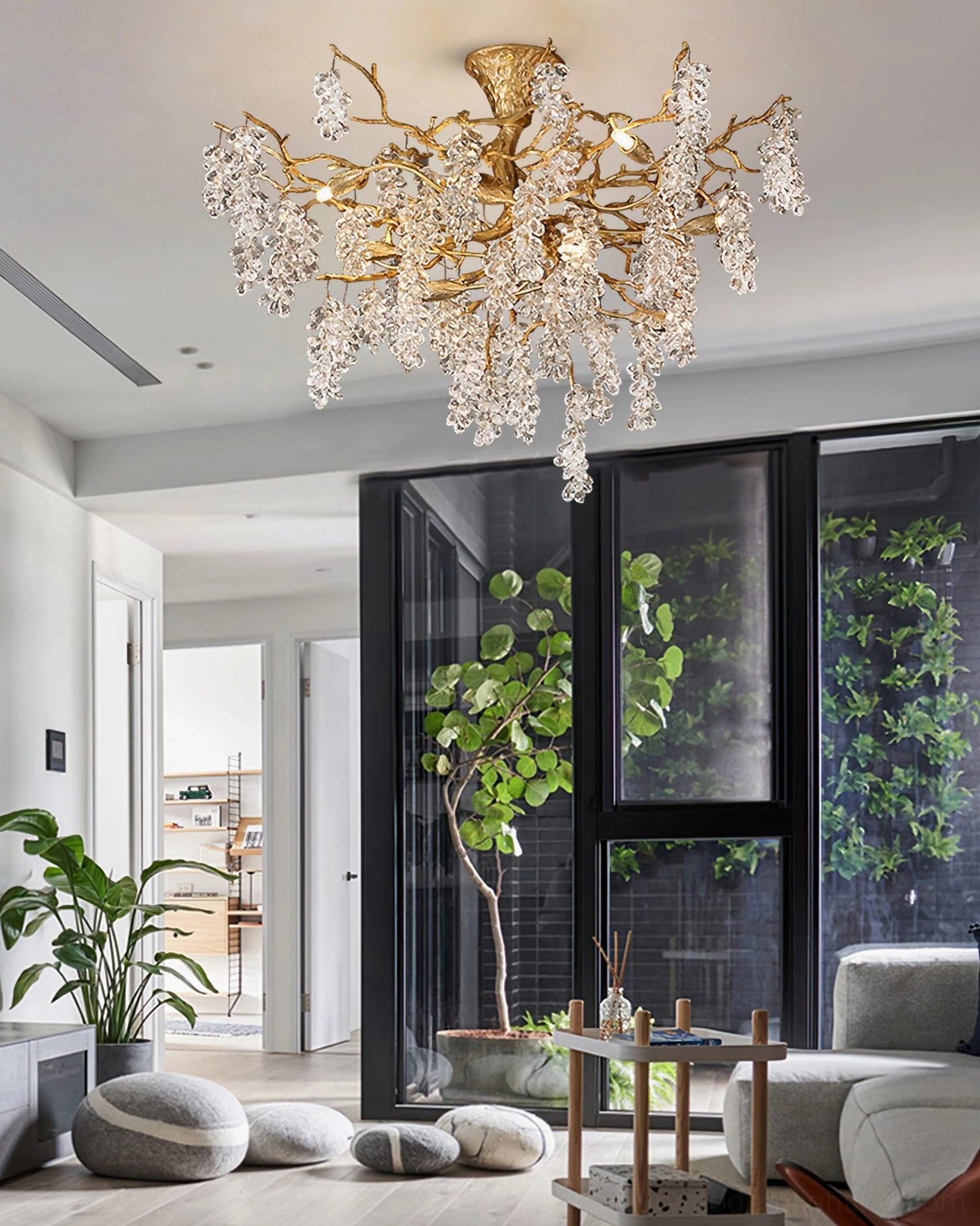 Bright modern living area with floor-to-ceiling windows featuring installed grape bunch chandelier adding warm luxury to minimalist interior