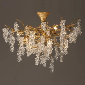 Semi-flush mount grape bunch chandelier displaying brushed gold branches with dangling crystal grape clusters on dark gray background