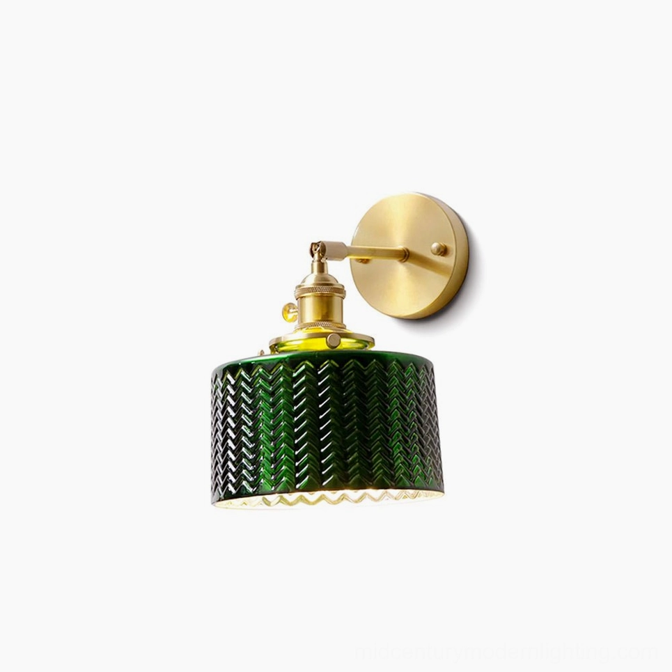 Vintage green glass wall sconce with chevron pattern and brass gold fixtures, front three-quarter studio view