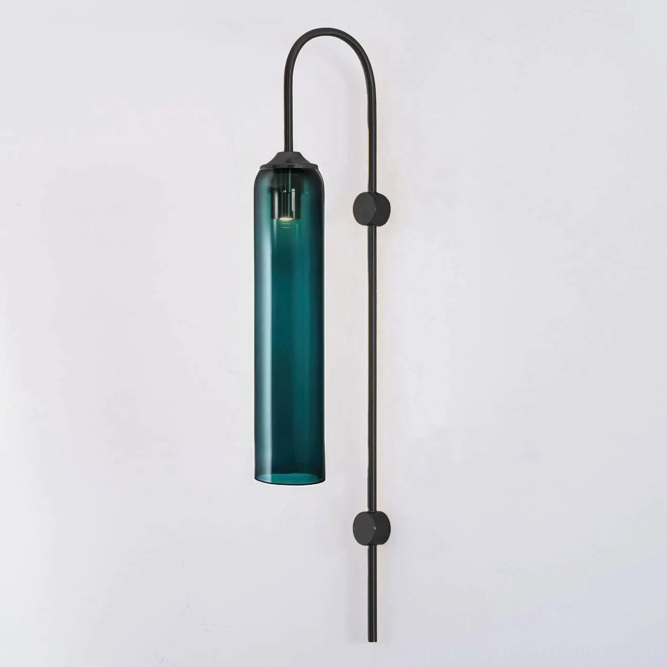 Green glass wall sconce bringing nature-inspired organic energy to contemporary interior spaces