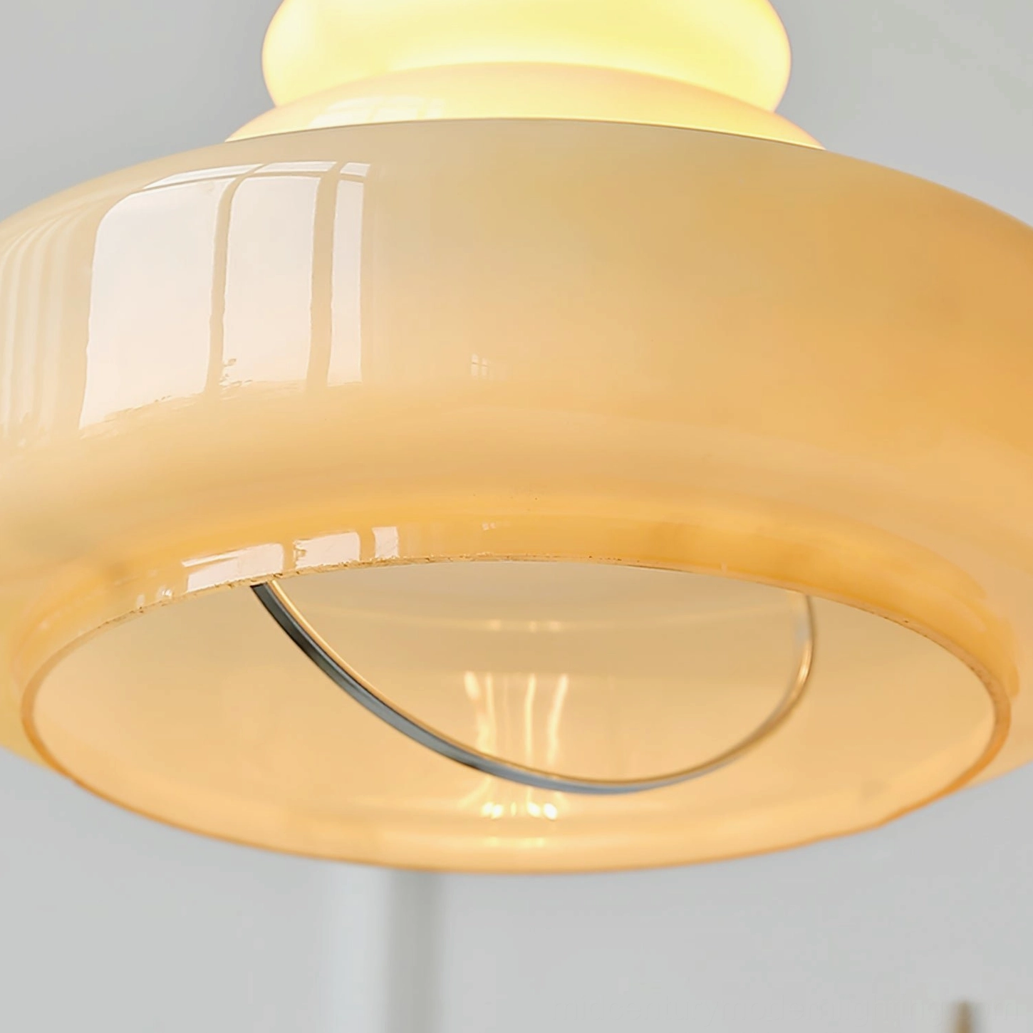 Green gourd glass pendant light paired with warm LED bulb for modern energy-efficient ambient lighting solution