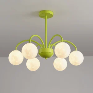 Close-up detail of green metal flower-arm chandelier showing curved arms and frosted round lamp covers