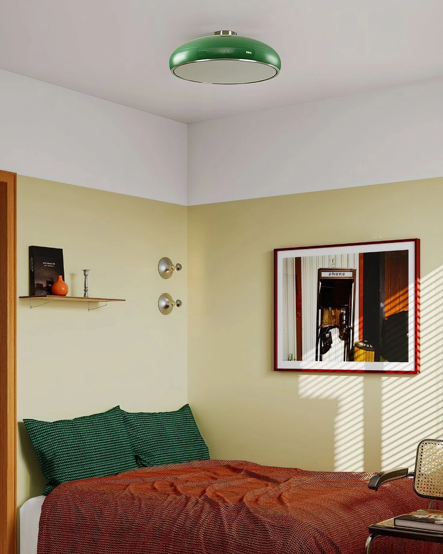 Green Aicia ceiling lamp installed in mid-century modern bedroom with coordinating green accent pillows and minimalist décor