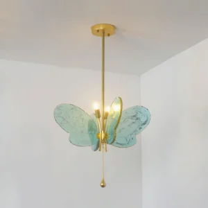 Green marbled butterfly pendant chandelier with warm LED lighting, displayed in white bedroom interior