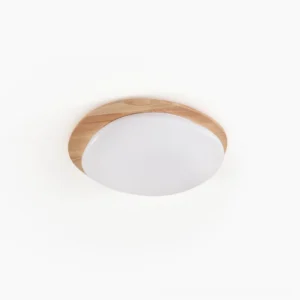 Gregg oval flush mount ceiling lamp with natural wood frame and matte white opaline acrylic shade, overhead studio view