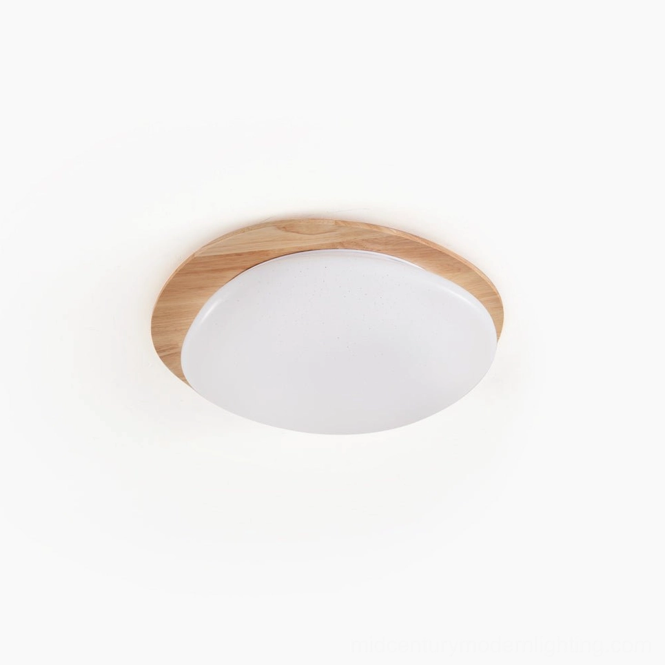 Gregg oval flush mount ceiling lamp with natural wood frame and matte white opaline acrylic shade, overhead studio view