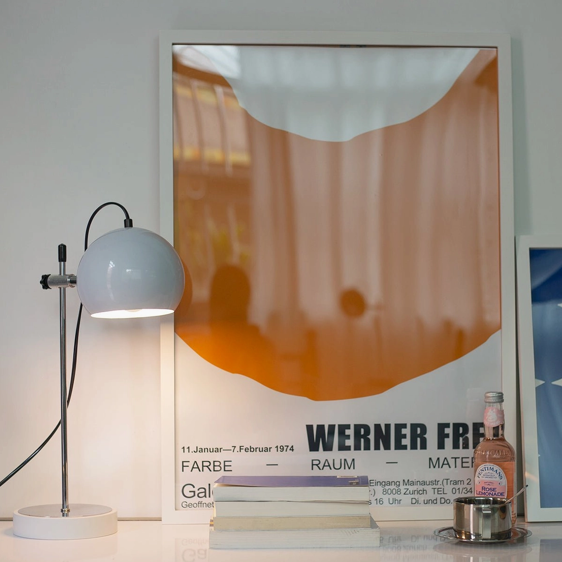 Grey matte ball bracket table lamp with modern minimalist design on workspace desk