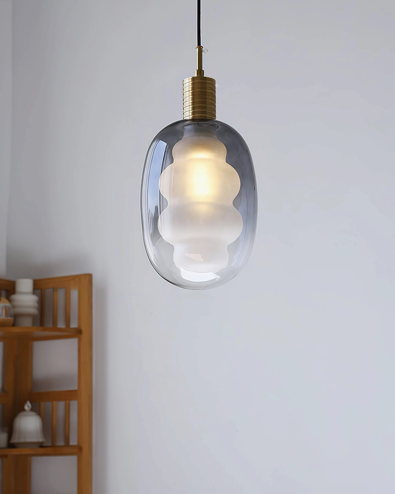 Grey gradient pendant light with brass metal accents, wooden shelf interior, mid-century modern style