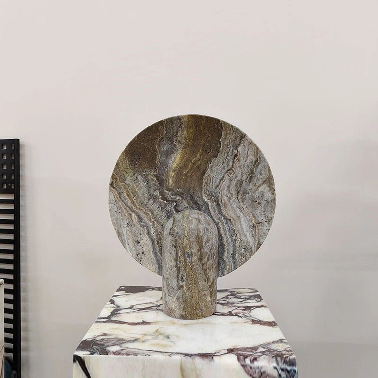 Grey marble table lamp three-quarter side view with layered marble grain pattern on matching marble base rack displaying geometric precision
