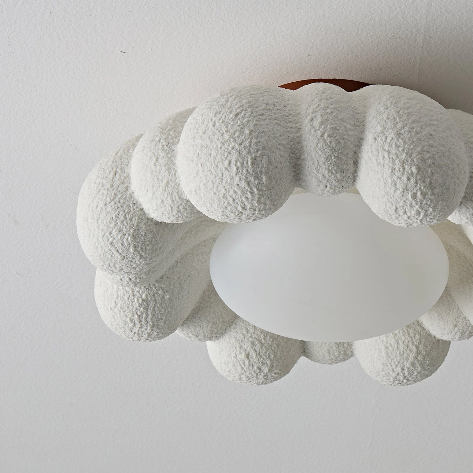 Gross cloud flush mount ceiling fixture showing warm LED illumination, medium frame, detailed view of resin texture