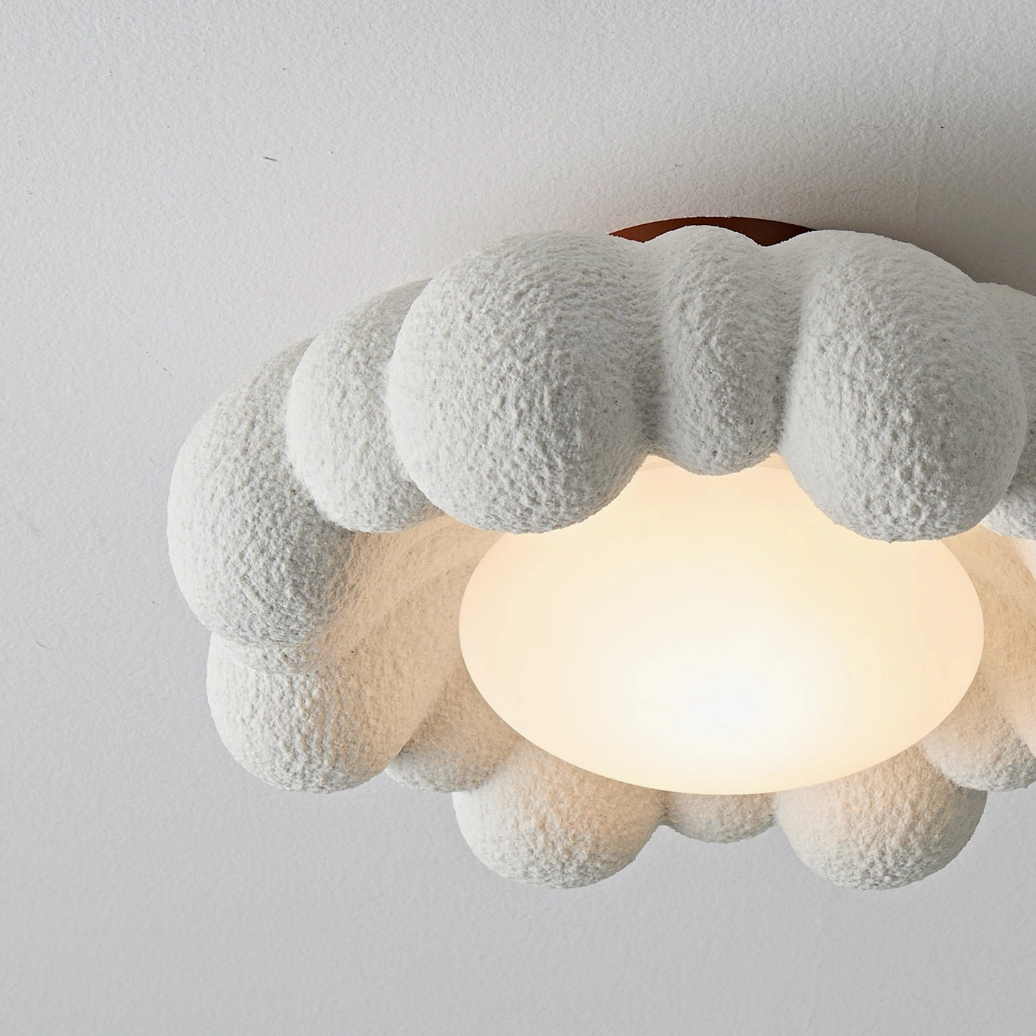 Gross modern cloud-style ceiling light fixture with organic segmented design, integrated warm LED technology