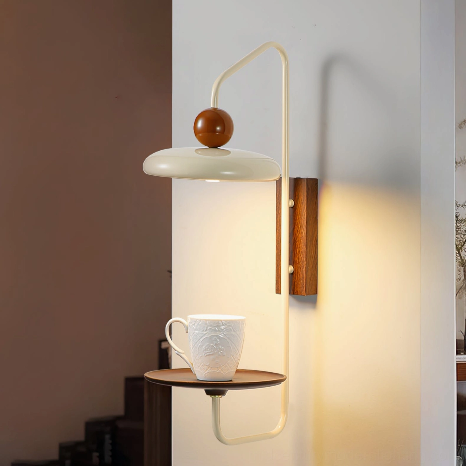 Grote wall sconce with storage shelf holding ceramic mug, stairwell interior setting