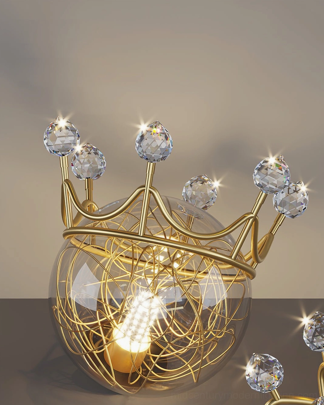 Detailed close-up of crown pendant with faceted crystal decorations and polished brass metalwork