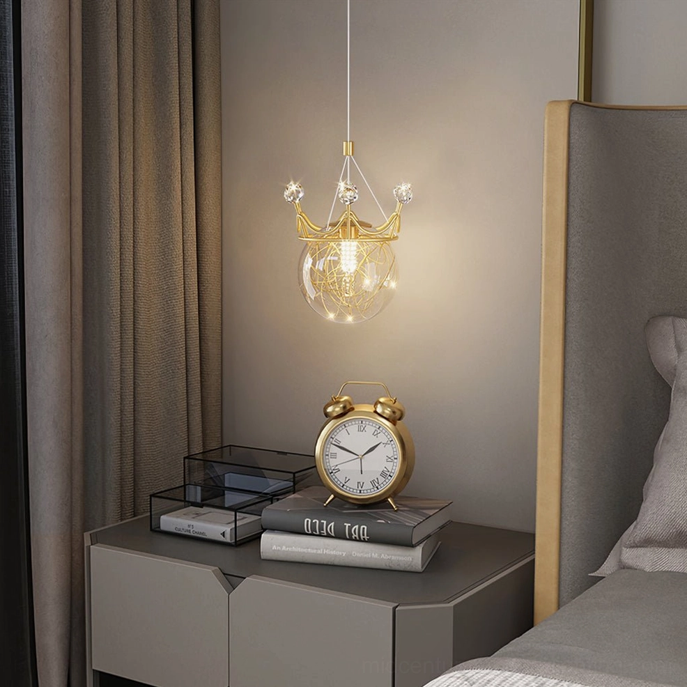 Crown wall sconce mounted above modern bedroom bedside table creating warm ambient lighting