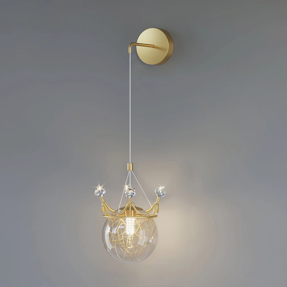 Golden brass wall-mounted crown sconce with round mount and elegant hand-blown glass spheres
