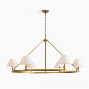 Hackney six-arm brass chandelier front view with white fabric shades and warm gold frame, studio lighting