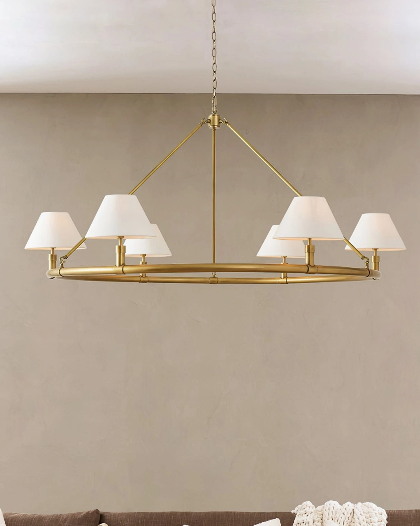 Hackney pendant light with white tapered fabric shades and polished gold metal frame, flat perspective