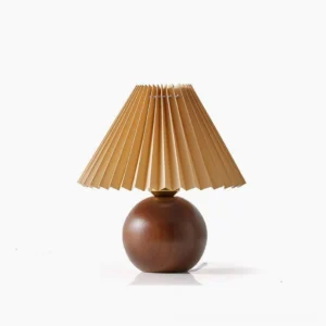 Haddie mid-century modern pleated table lamp with khaki fabric shade and walnut wood spherical base on white studio background
