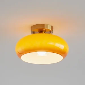 Illuminated Hailie mid-century ceiling fixture showing warm light diffusion through gradient glass shade