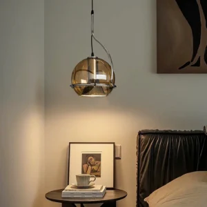 Halo pendant light suspended in cozy bedroom interior - warm ambient lighting above nightstand