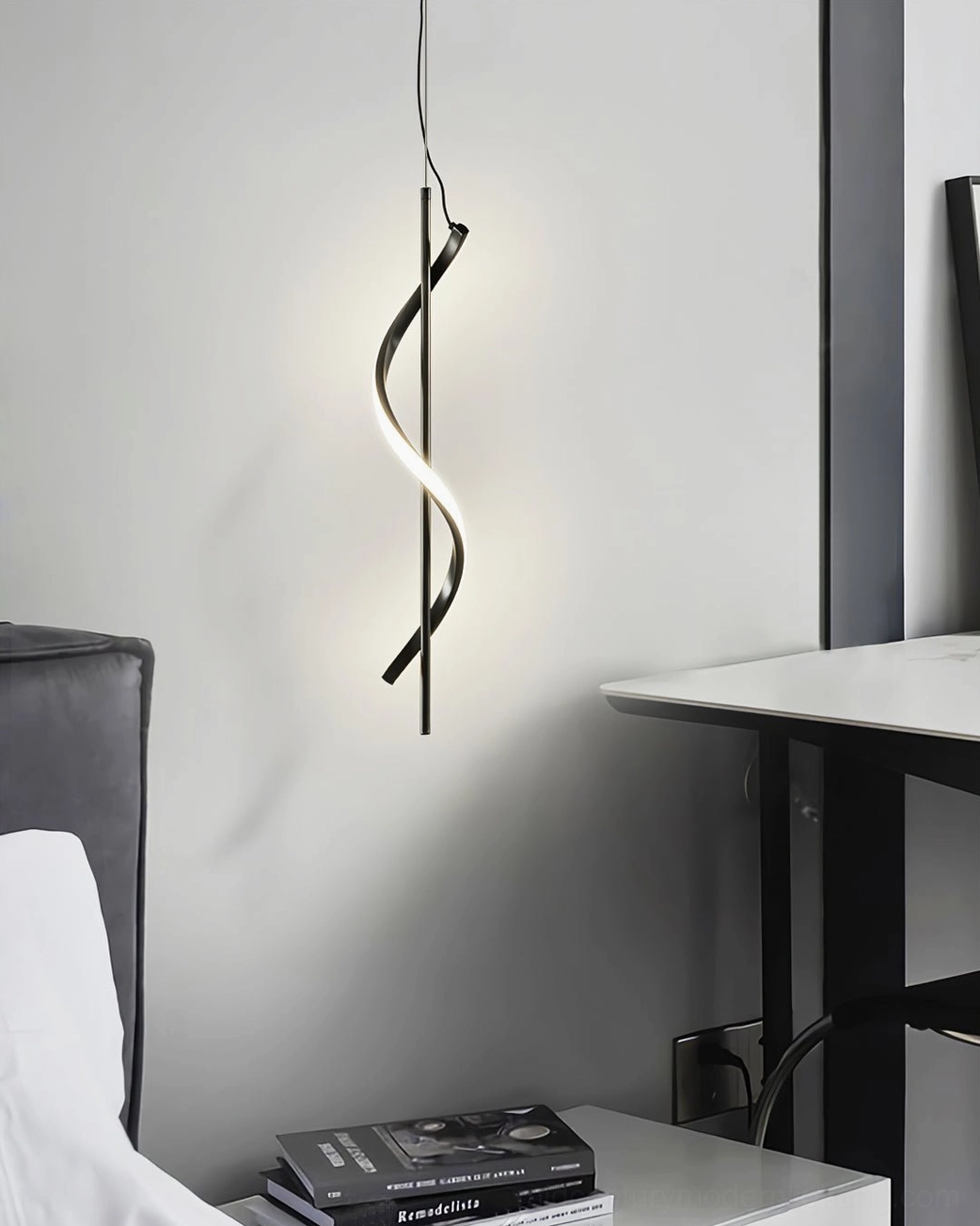 Matte black Hamburg spiral pendant in home office or bedroom resting area with contemporary minimalist finish