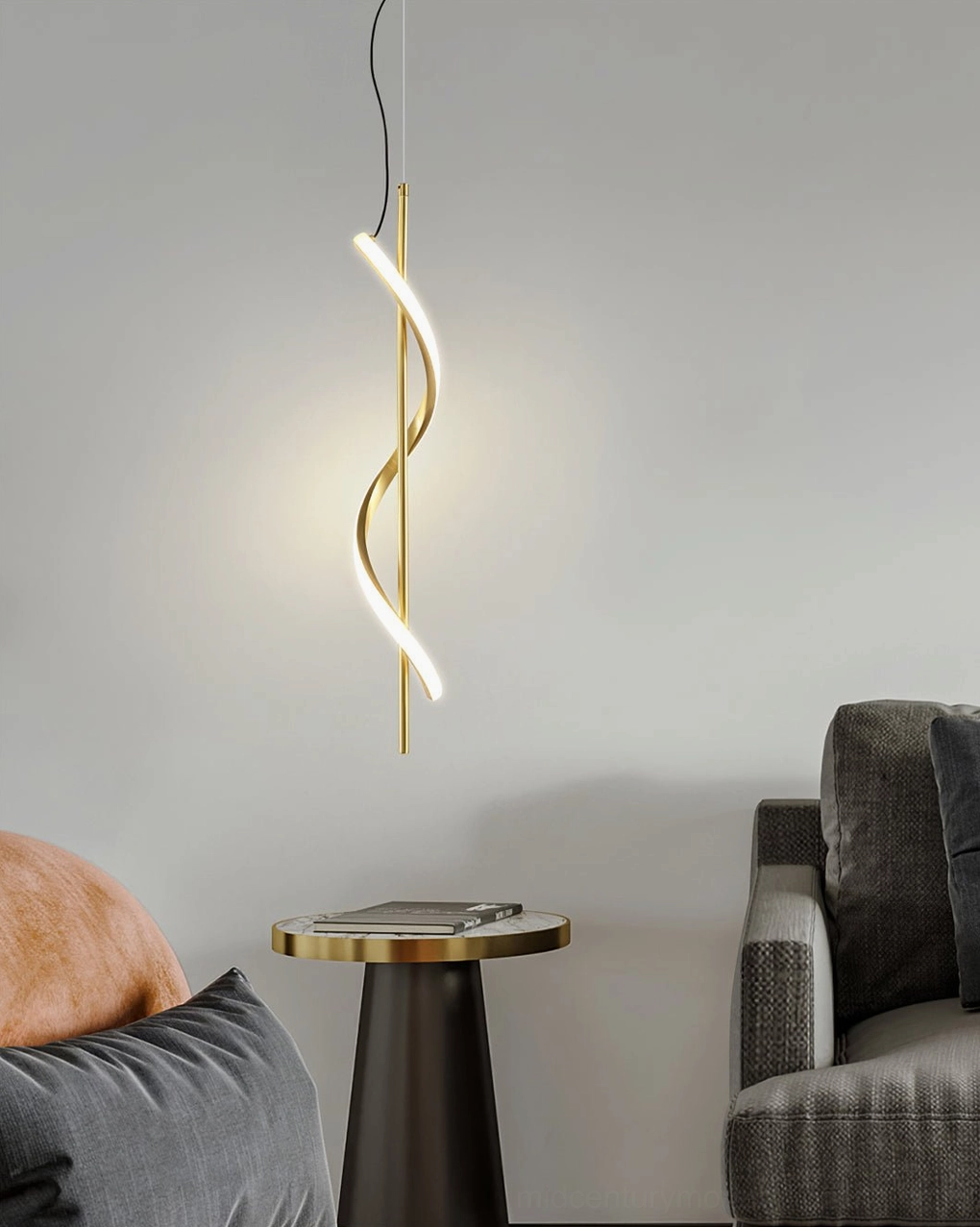 Gold Hamburg pendant lamp hanging in cozy living room corner with warm light and minimalist styling