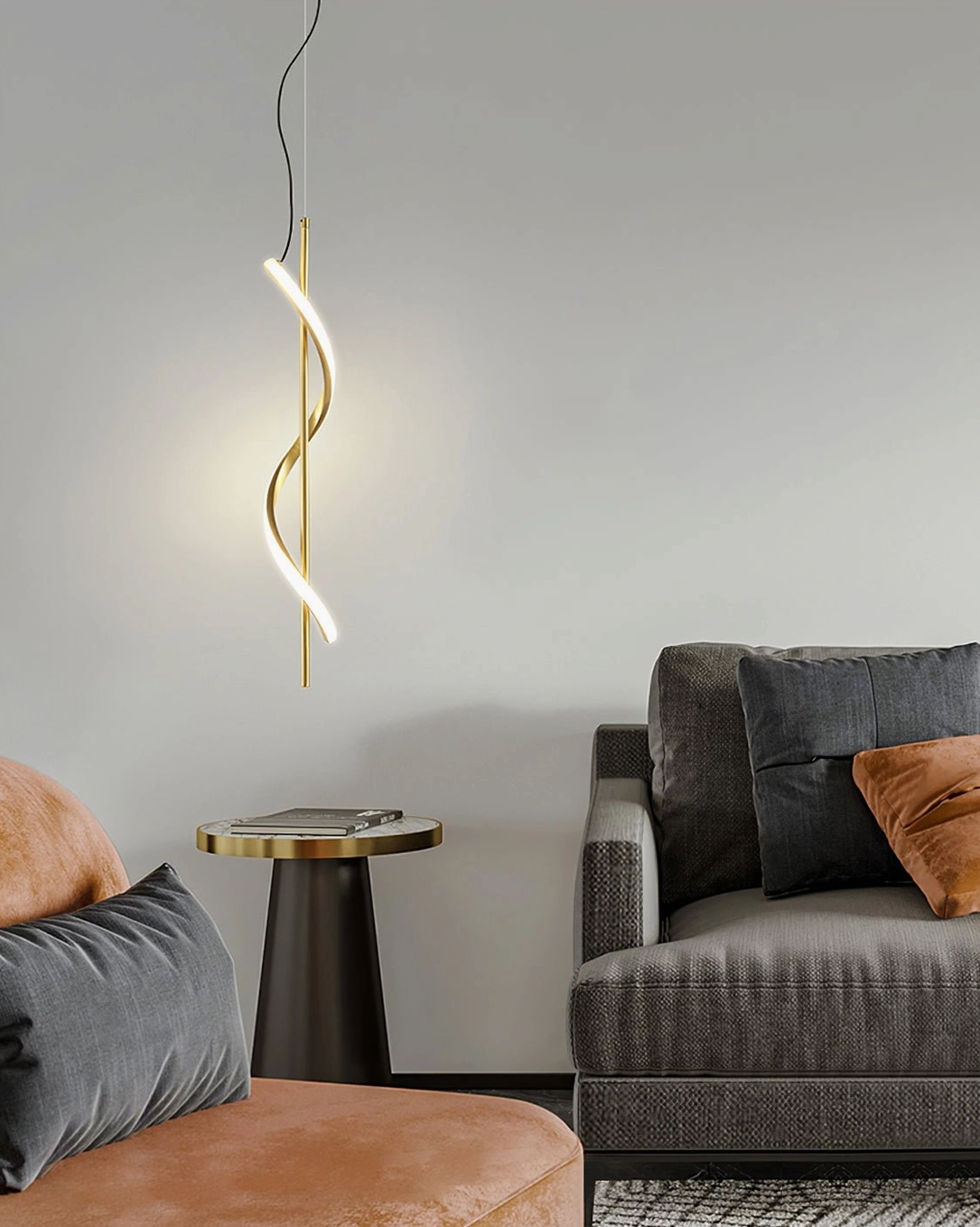 Gold Hamburg spiral pendant lamp in modern living room with polished brass finish and twisted design creating ambient light