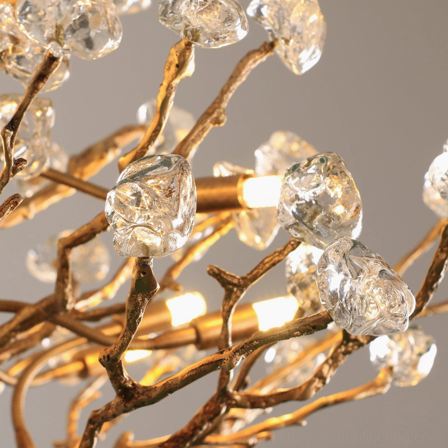 Hand-blown glass gemstone branch chandelier sparkling light refraction artistic detail