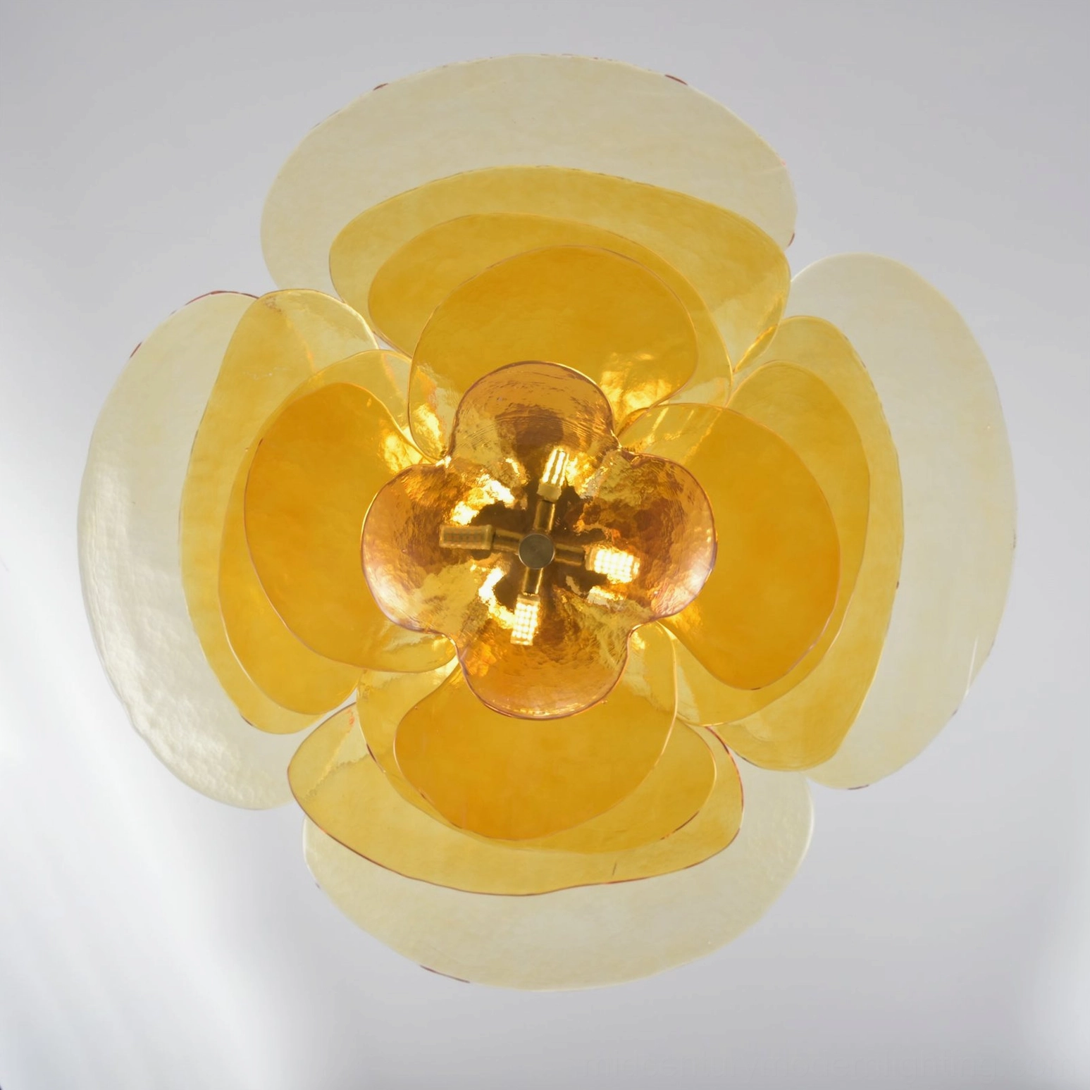 Hand-blown Murano lotus leaf chandelier showing layered glass petal construction and light diffusion