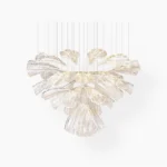 Hand-cut glass lotus chandelier with chrome frame and layered clear glass petals on white background, modern pendant light fixture