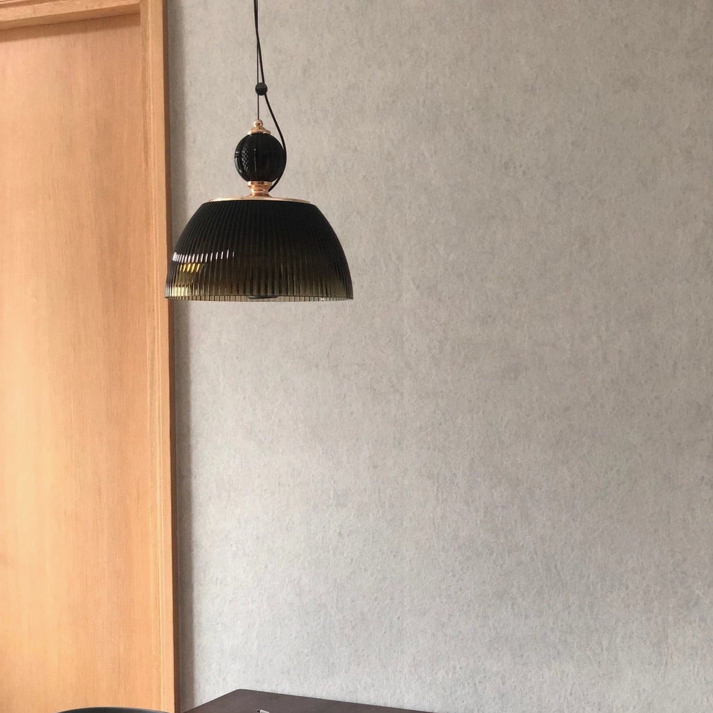 Close-up of ribbed glass pendant dome showing hand-finished quality and authentic vintage craftsmanship