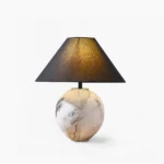 Hand-painted ceramic table lamp with white linen shade on white studio background, front view