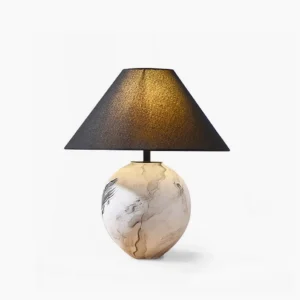 Hand-painted ceramic table lamp with white linen shade on white studio background, front view