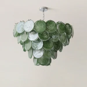 Close-up of Verde tiered glass disc chandelier showing rippled texture and deep green color variations