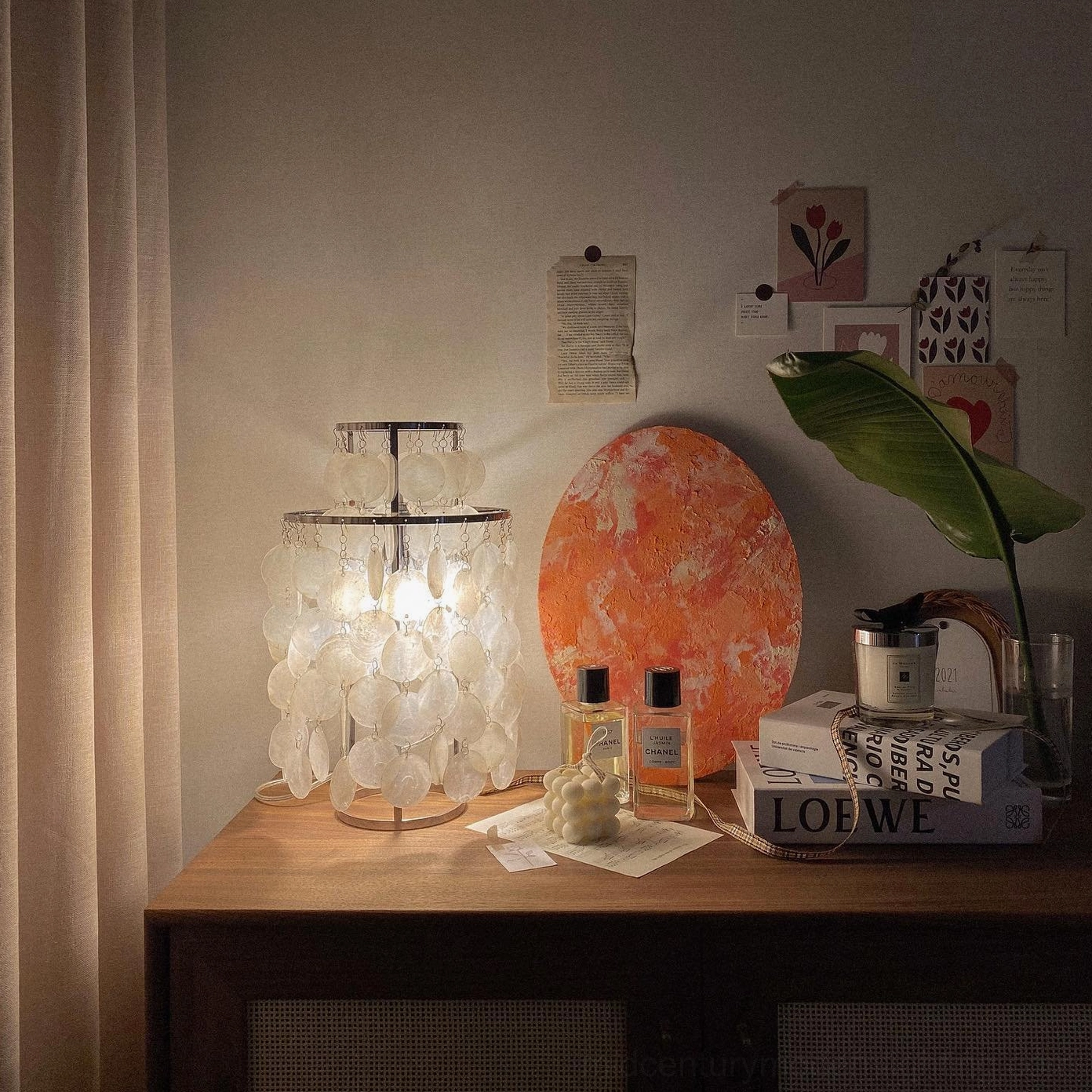 Handcrafted mother-of-pearl shell table lamp showing organic shell composition
