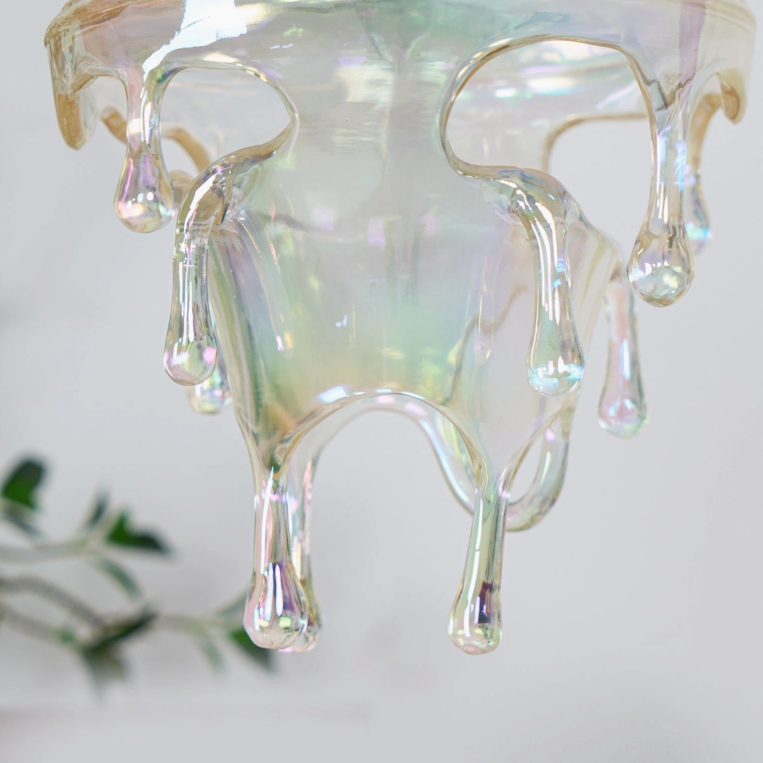 Handcrafted resin water droplets pendant showing surface variations and authentic handmade details