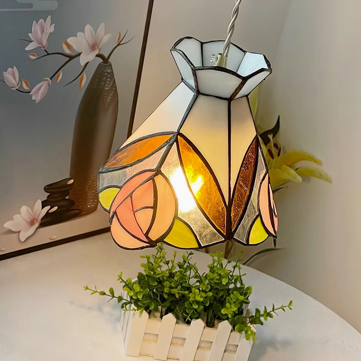 Handcrafted Tiffany pendant light with rose motif stained glass showing quality construction