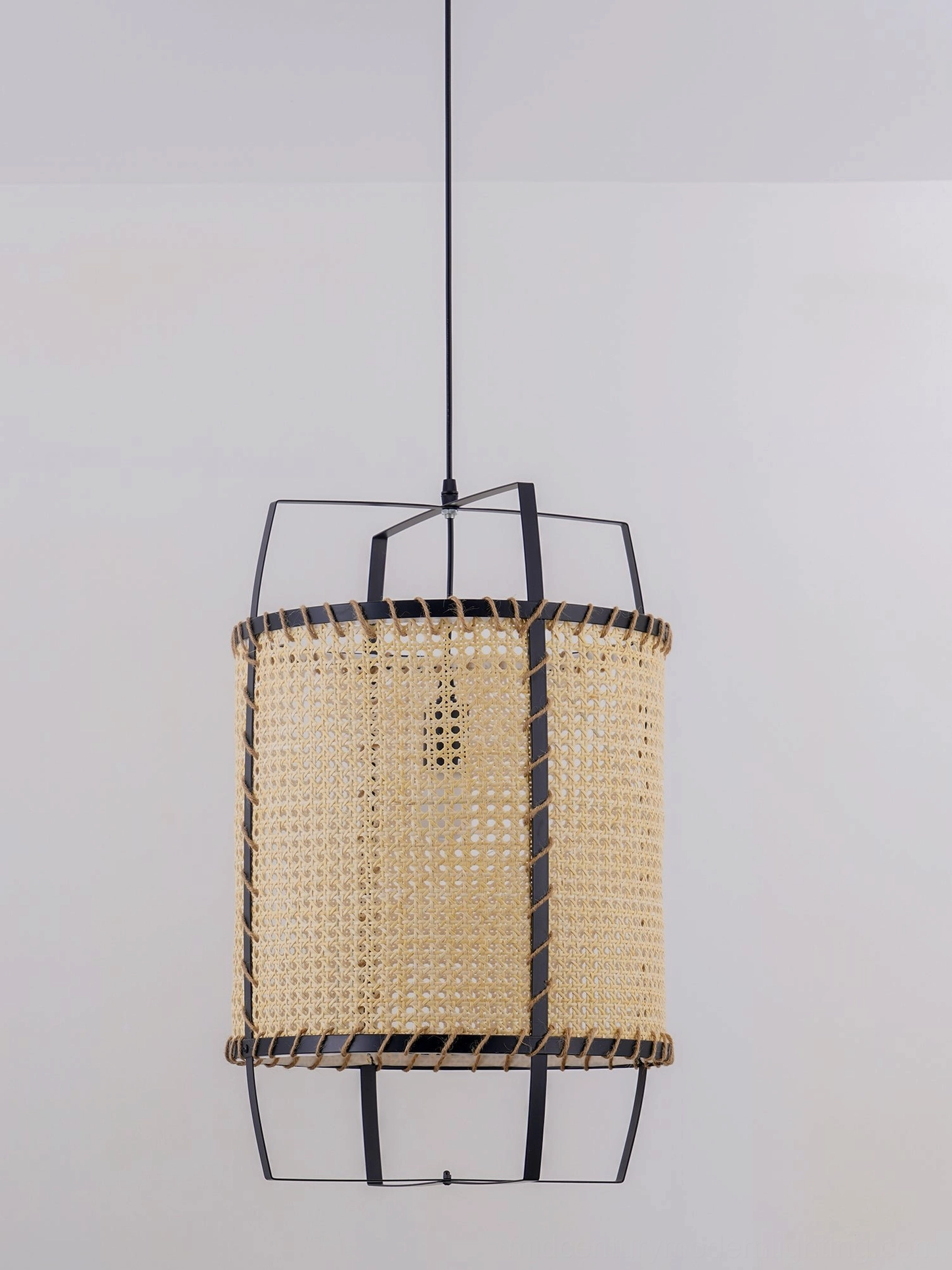 Handwoven rattan cane pendant lamp front view, showcasing natural bamboo-colored weaving, metal frame construction, and artisanal hand-stitched details