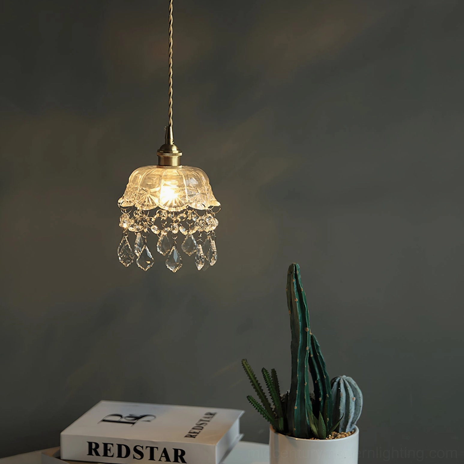 Crystal glass jewel pendant fixture hanging in interior space, ambient vintage lighting