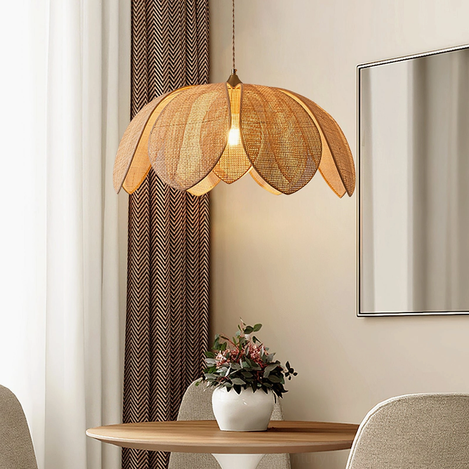 Hanove bohemian pendant light hanging above dining table in warm minimalist interior with natural light and curtains