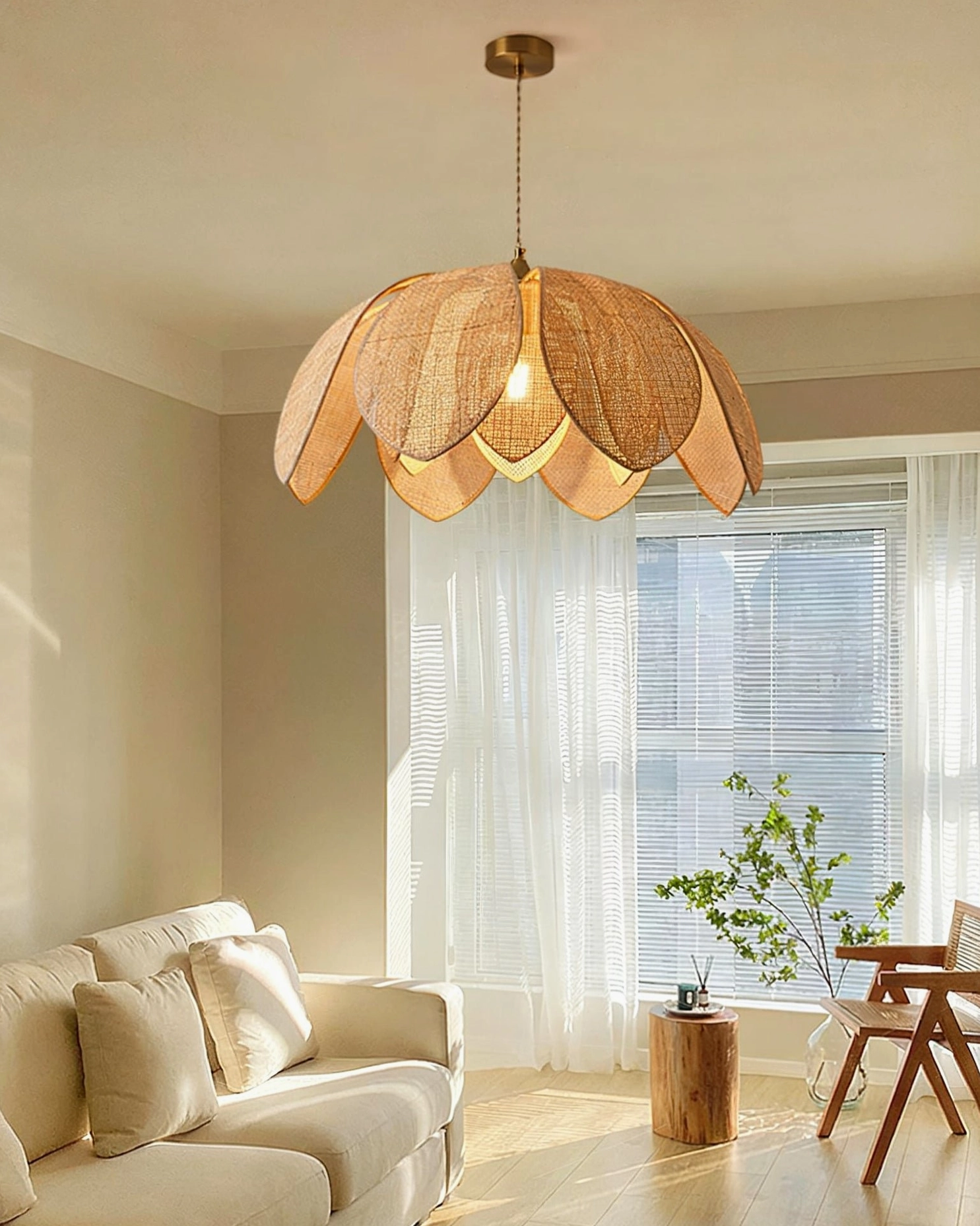 Hanove mid-century modern pendant light in contemporary living room with sofa and large window, ambient warm lighting